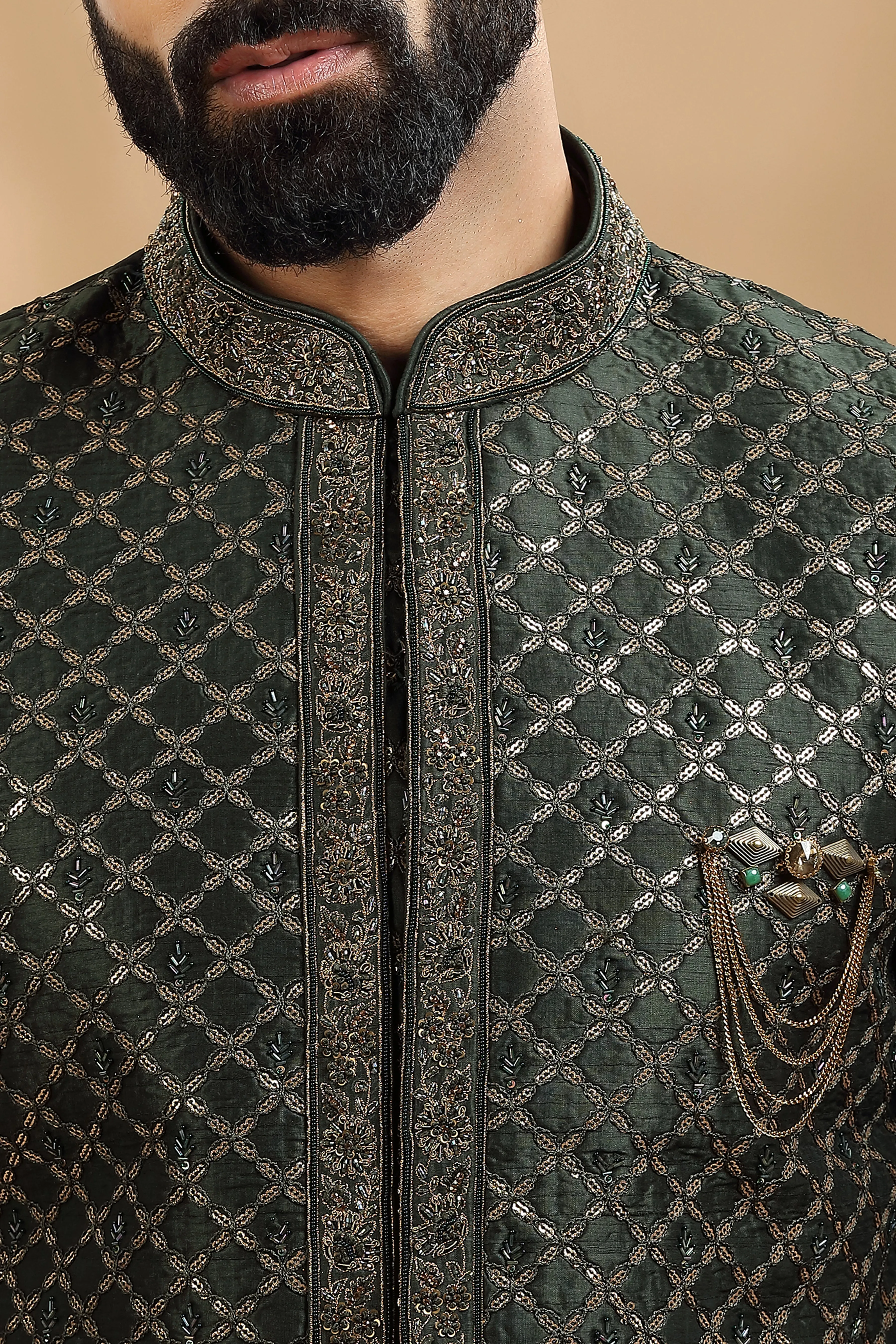 Green Double layered Sherwani Embellished with antique Gold thread work embroidery.