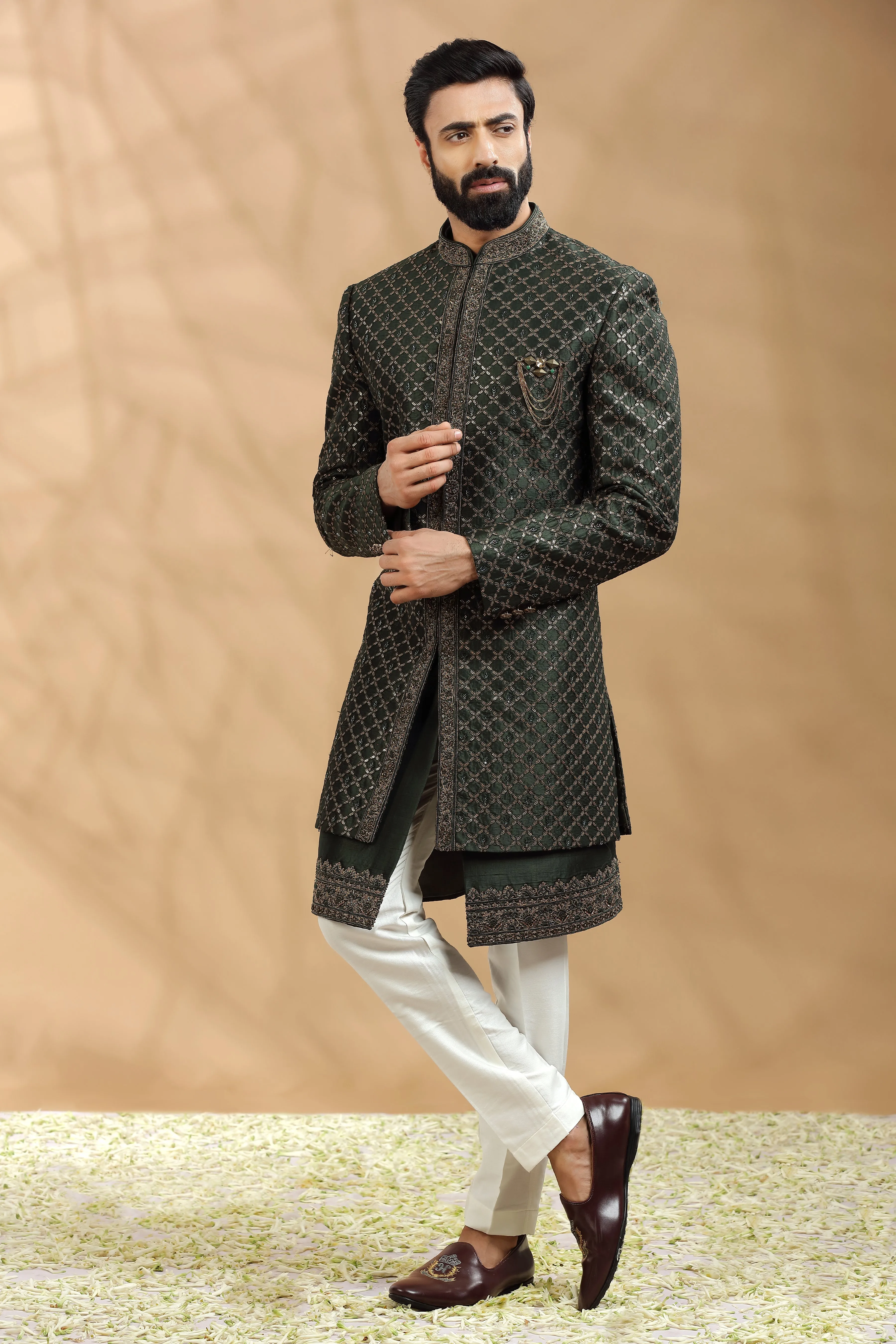 Green Double layered Sherwani Embellished with antique Gold thread work embroidery.