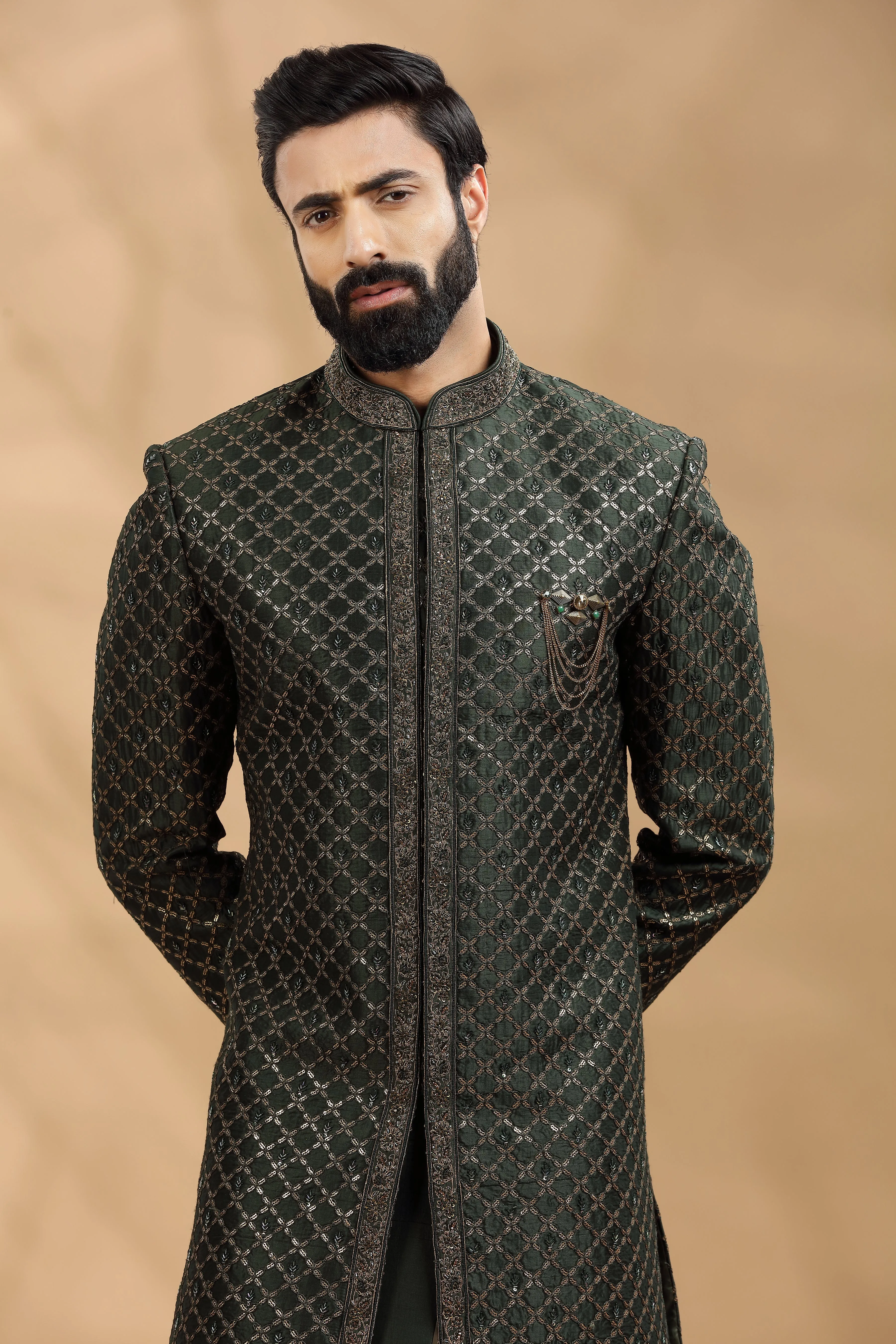 Green Double layered Sherwani Embellished with antique Gold thread work embroidery.